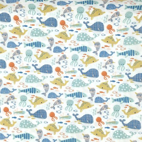 Motif coloré avec des baleines, des méduses et des poissons dans un style ludique.